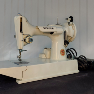 "Baby Gorgeous" 1968/69 Singer 221k White Featherweight with accessories and case